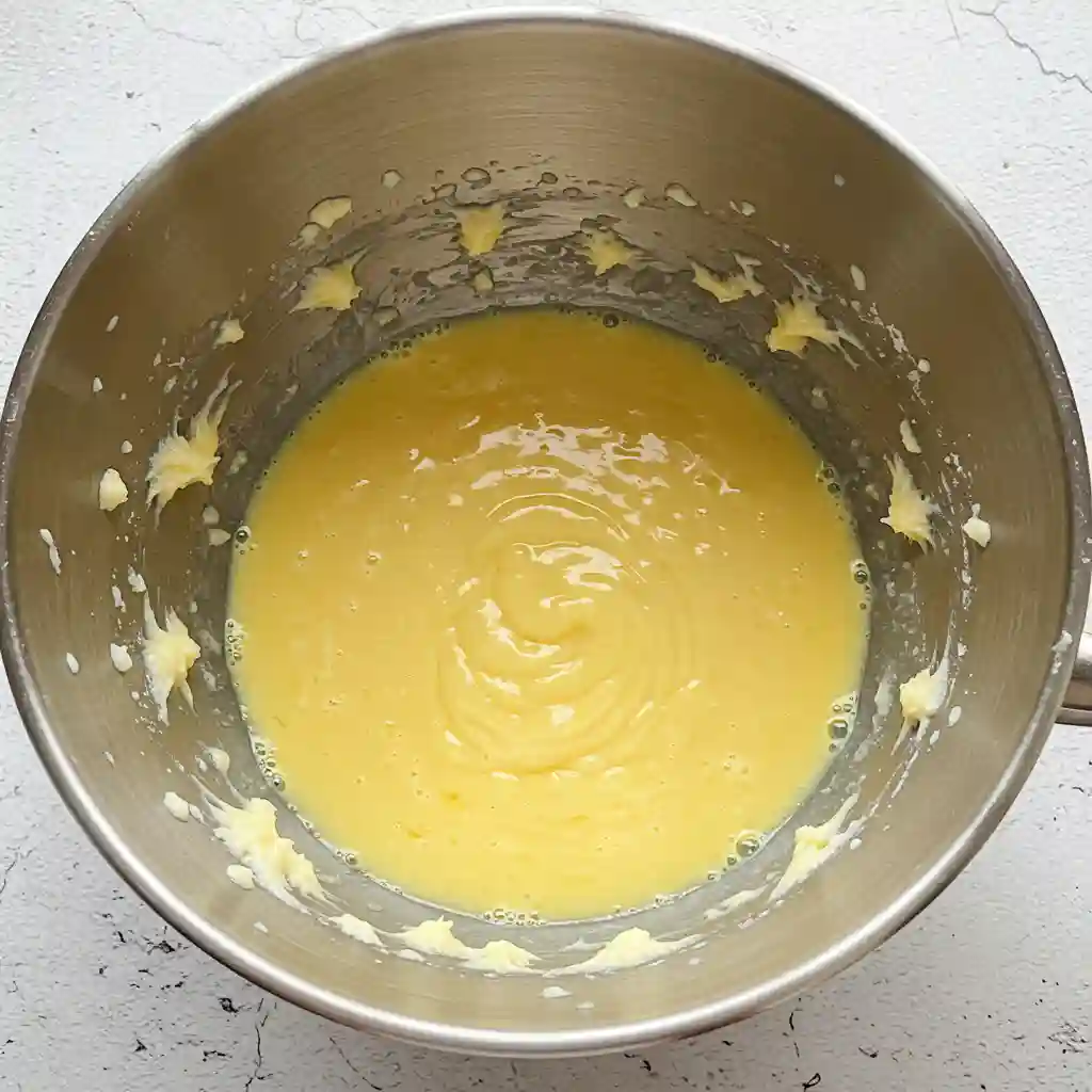 Creamed mixture for gluten free dairy free cookies in metal mixing bowl during batter preparation