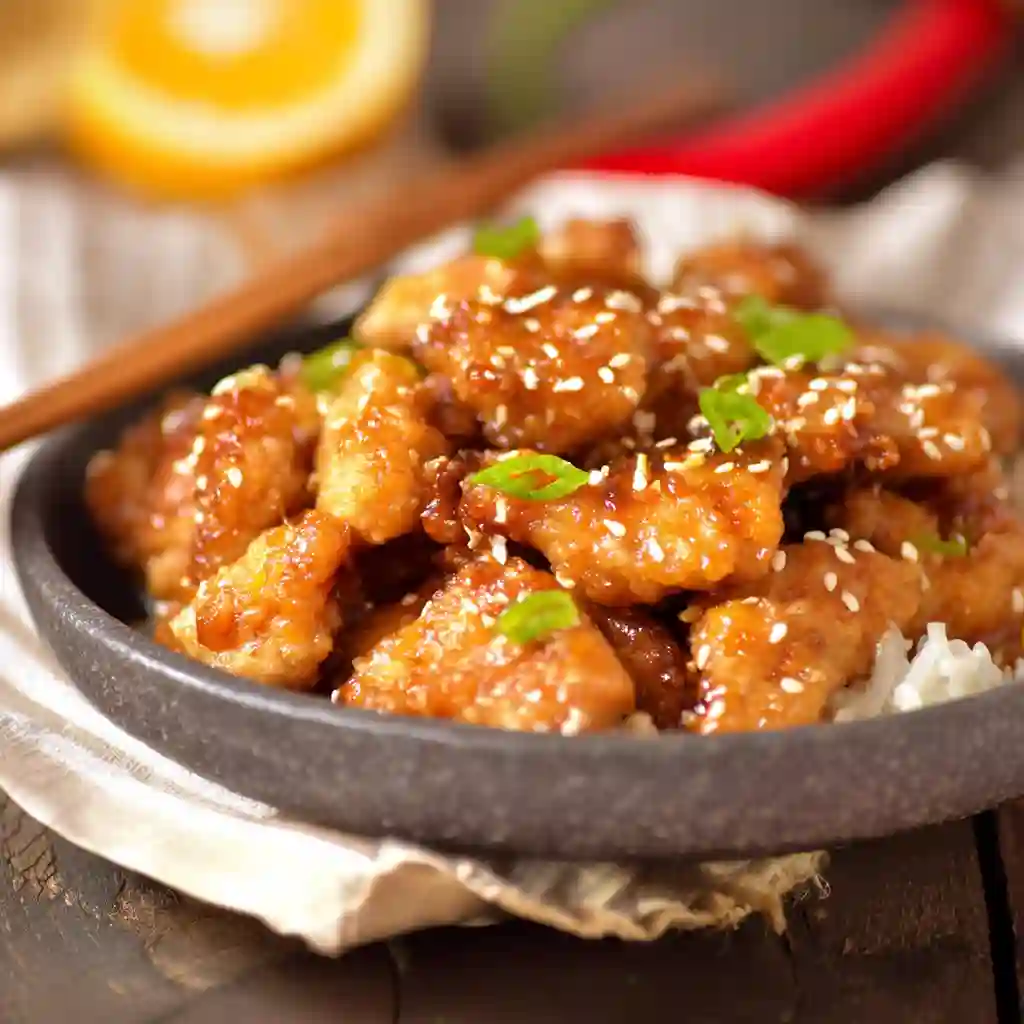  Ingredients for gluten-free orange chicken including fresh oranges, tamari, and cornstarch.
